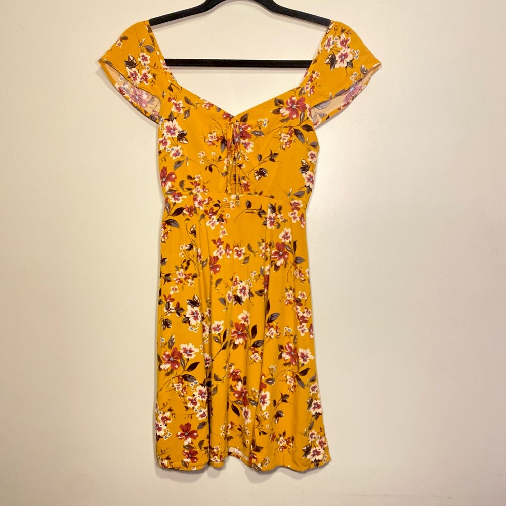 The dress is an Xs with open triangle in front